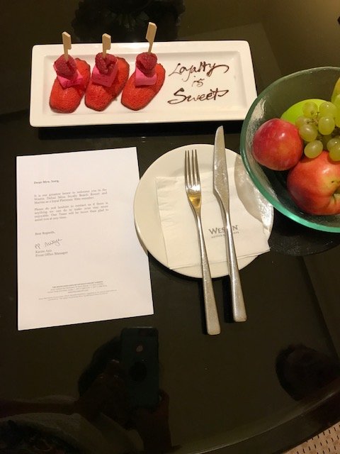 Dessert and fruit with welcome note from hotel