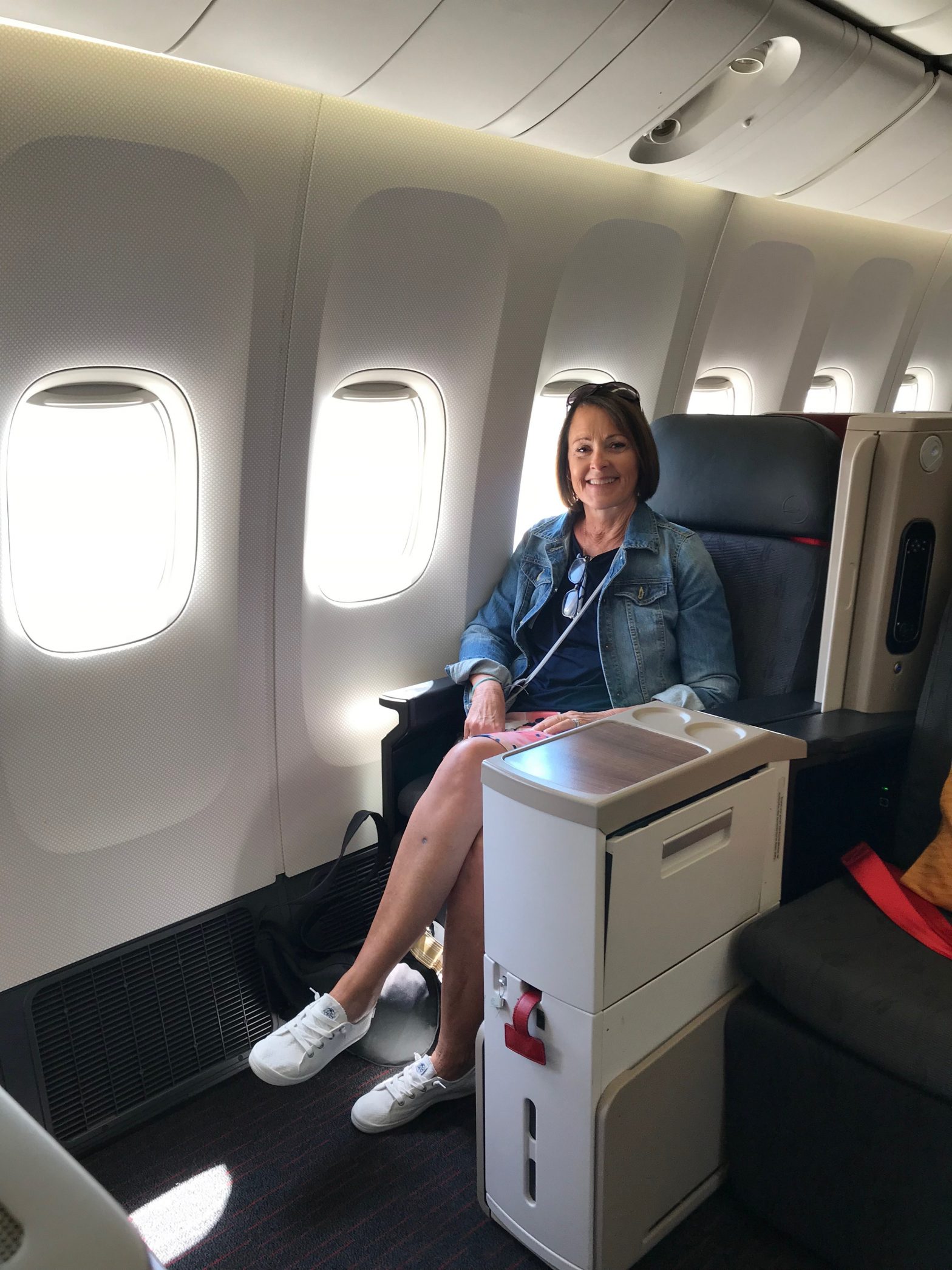 Woman sitting in business class seat