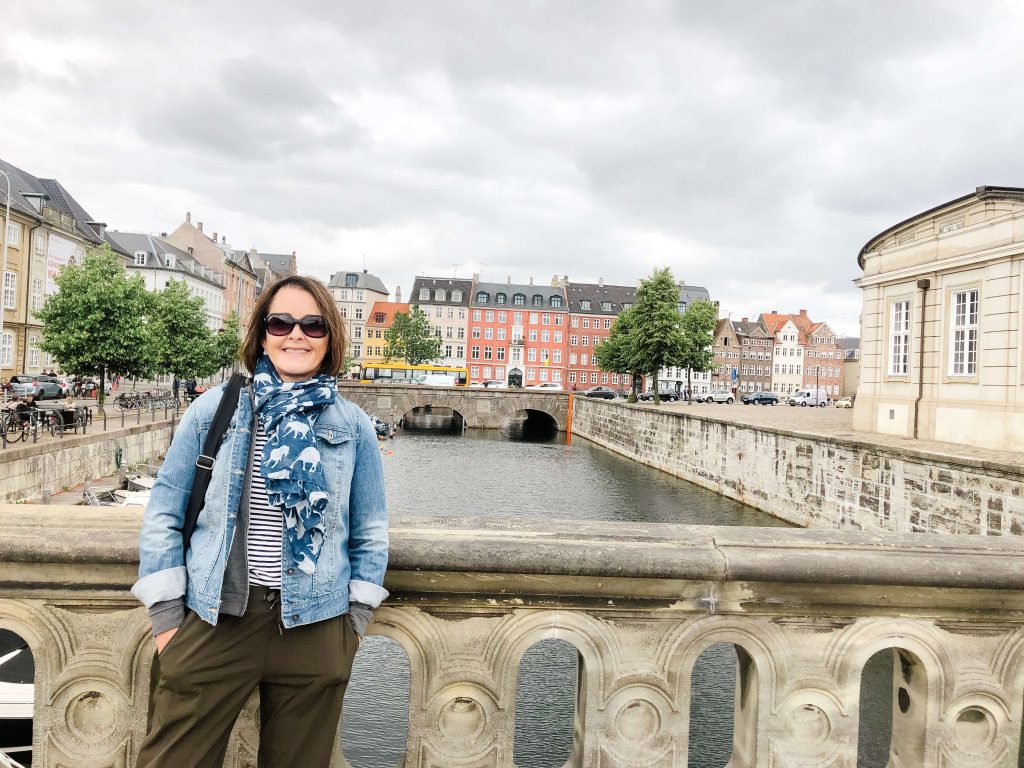 Woman standing on bridge in Copenhagen