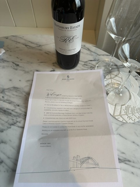 Bottle of wine with welcome letter at hotel.