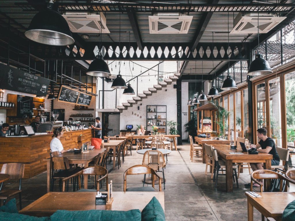 Multiple tables and chairs in building