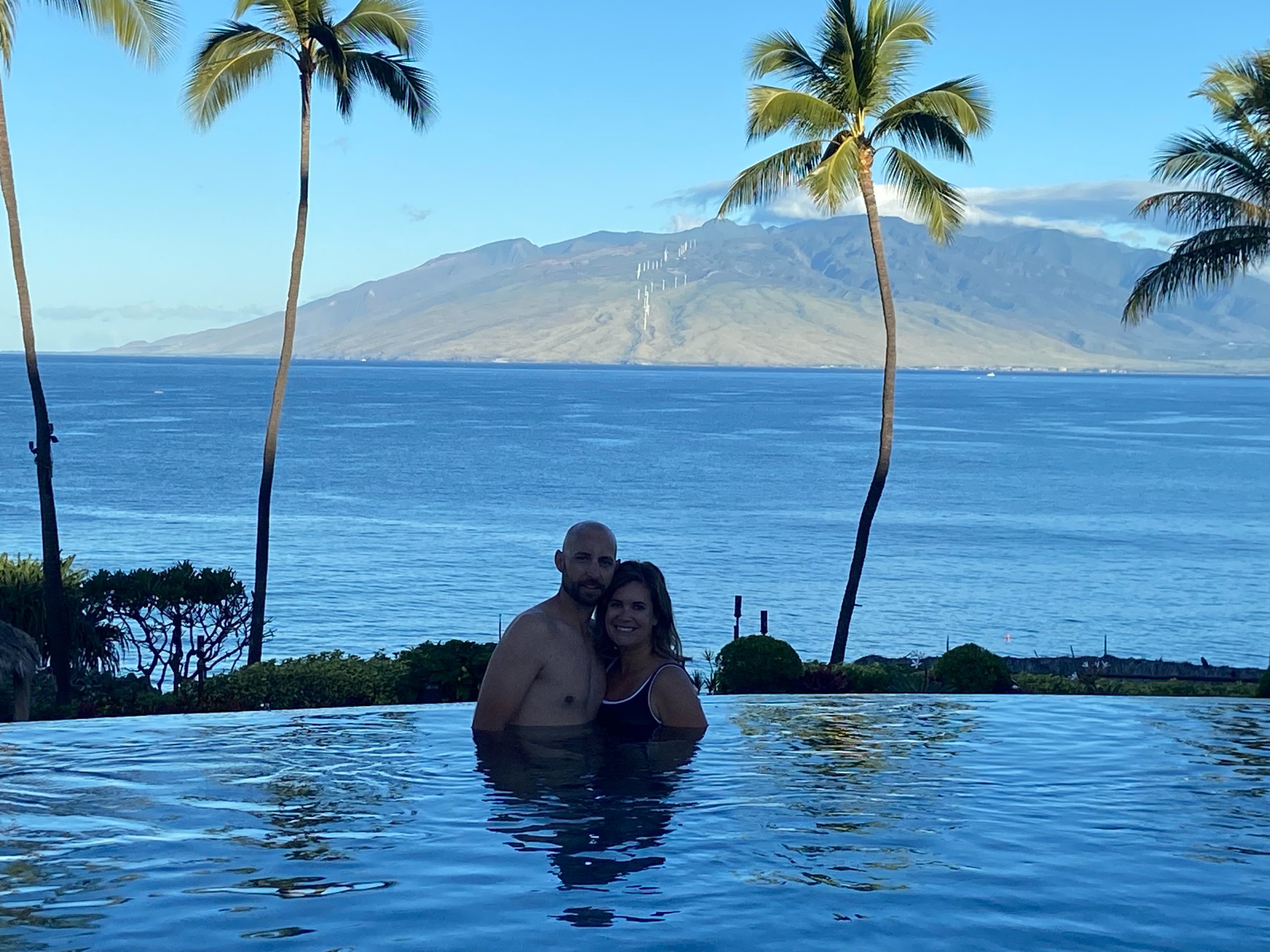 Man and woman in infinity pool