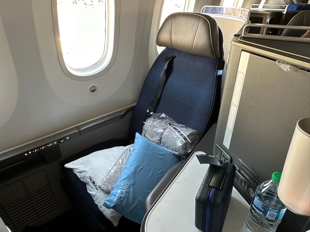 Blue business class airplane seat