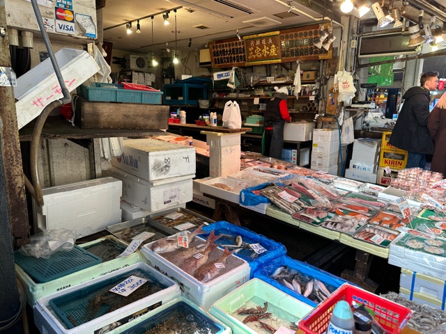 Outdoor market in Japan with fish.