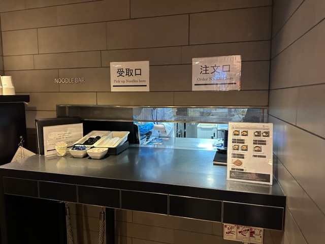 Counter with signs on it.