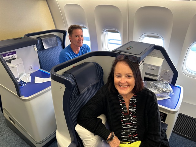 Man and woman sit-in in business class on airplane
