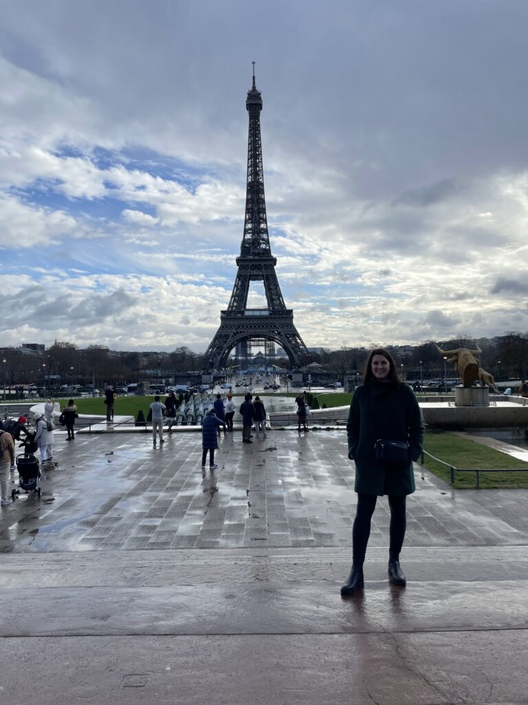 Woman standing in front of Eiffel Tower