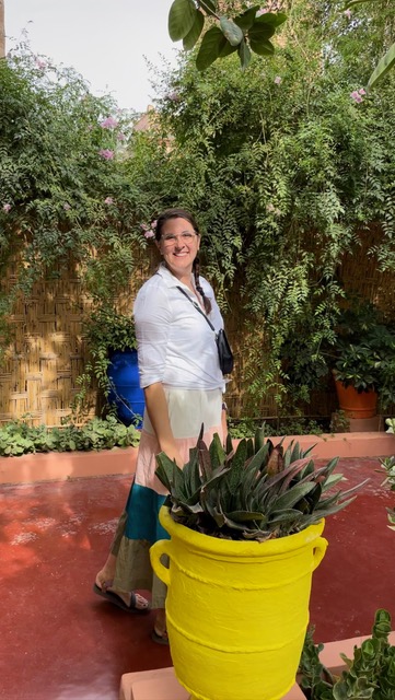 Woman by green plants on 10 Days In Morocco trip
