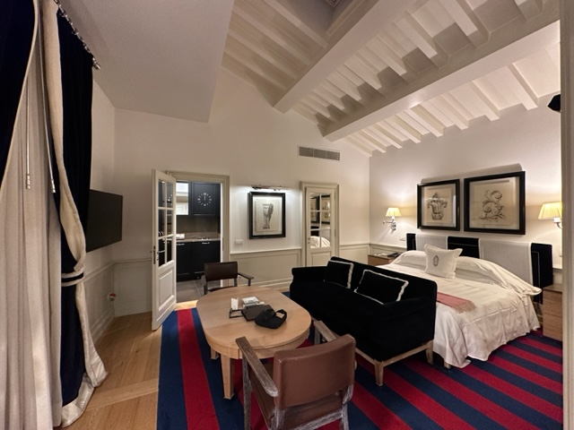 Hotel room with blue and red striped rug