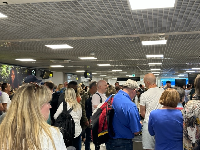 Crowd of people in baggage area