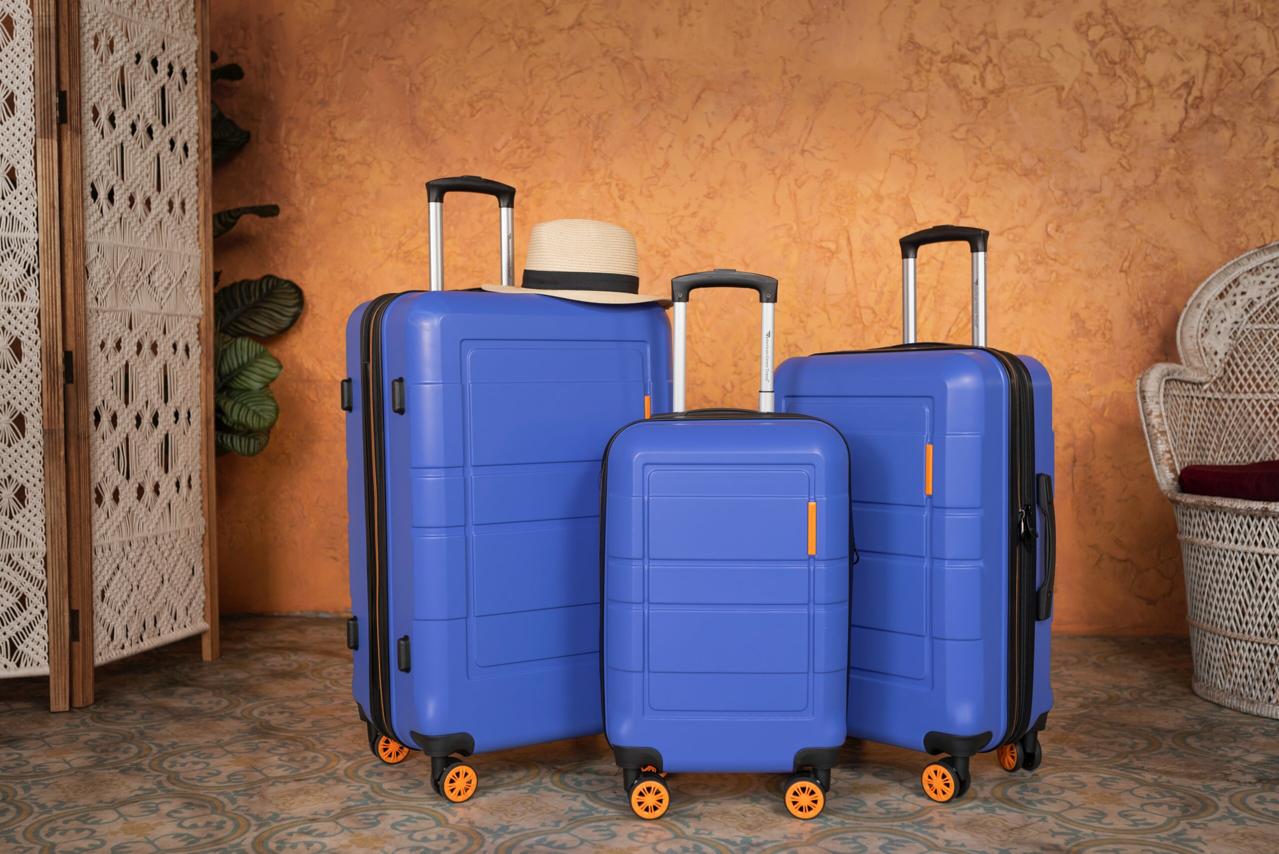 Set of three blue suitcases