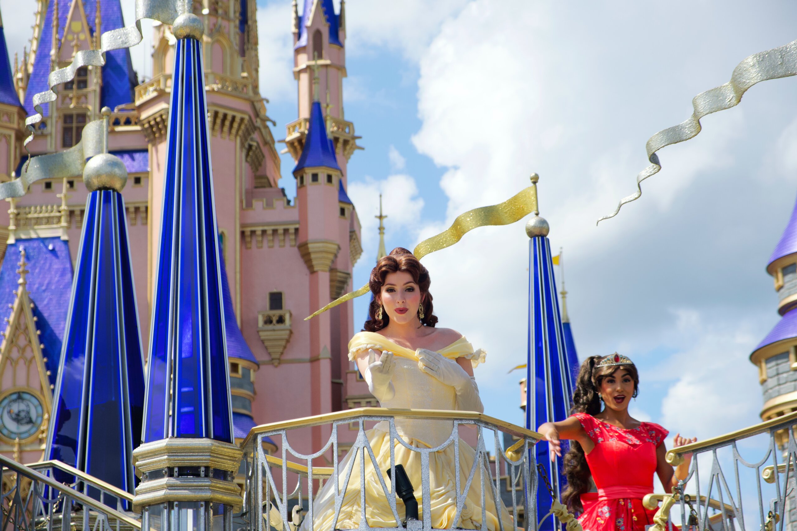 Princesses on float in front of castle