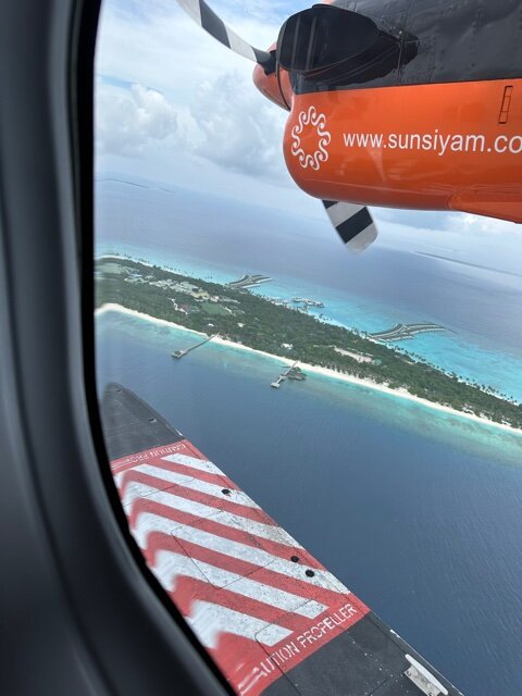 Seaplane approaching island - Mixing Points and Miles with Cash for a Maldives Trip