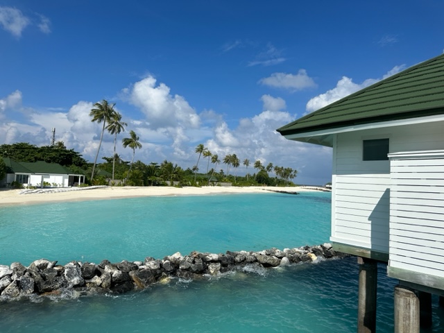 Over water bungalow with turquoise water - Mixing Points and Miles with Cash for a Maldives Trip
