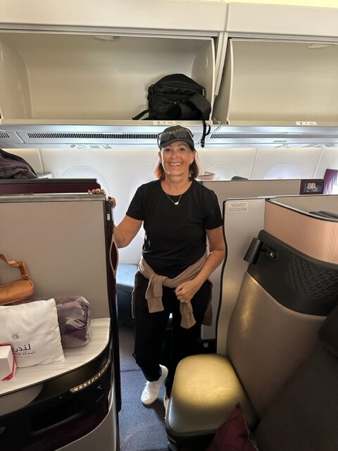 Woman by suite on airplane