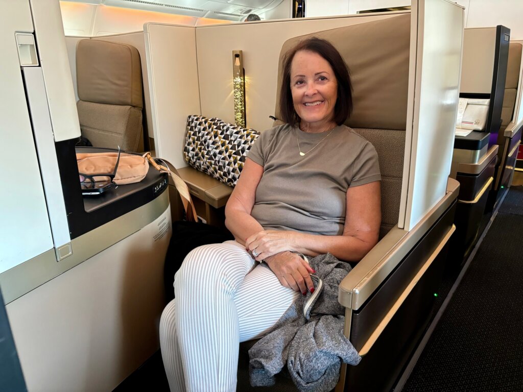 Woman sitting in business class seat