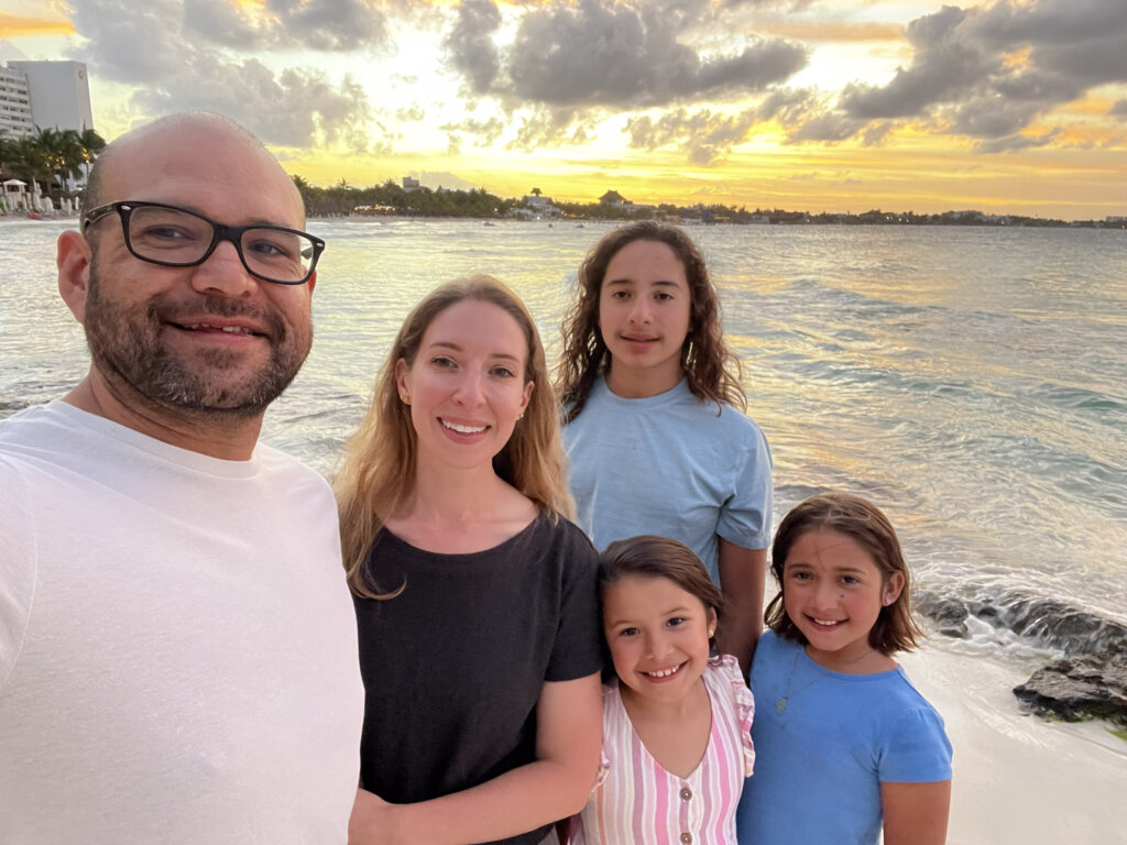 Family at beach at sunset