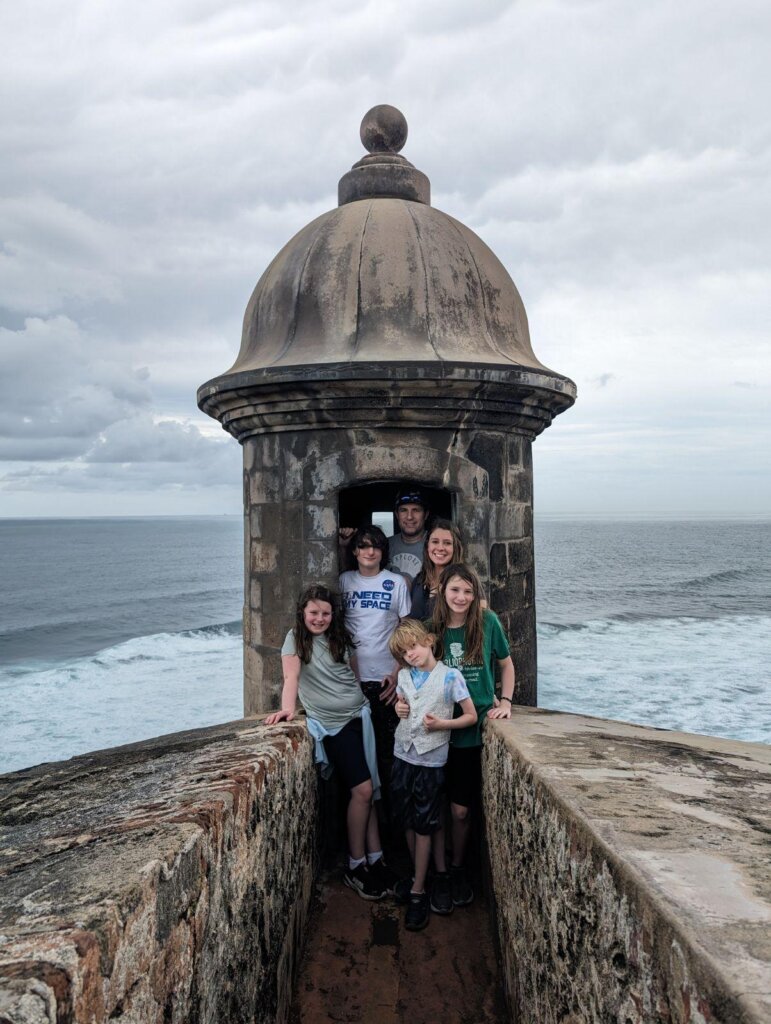 Family standing on old fort