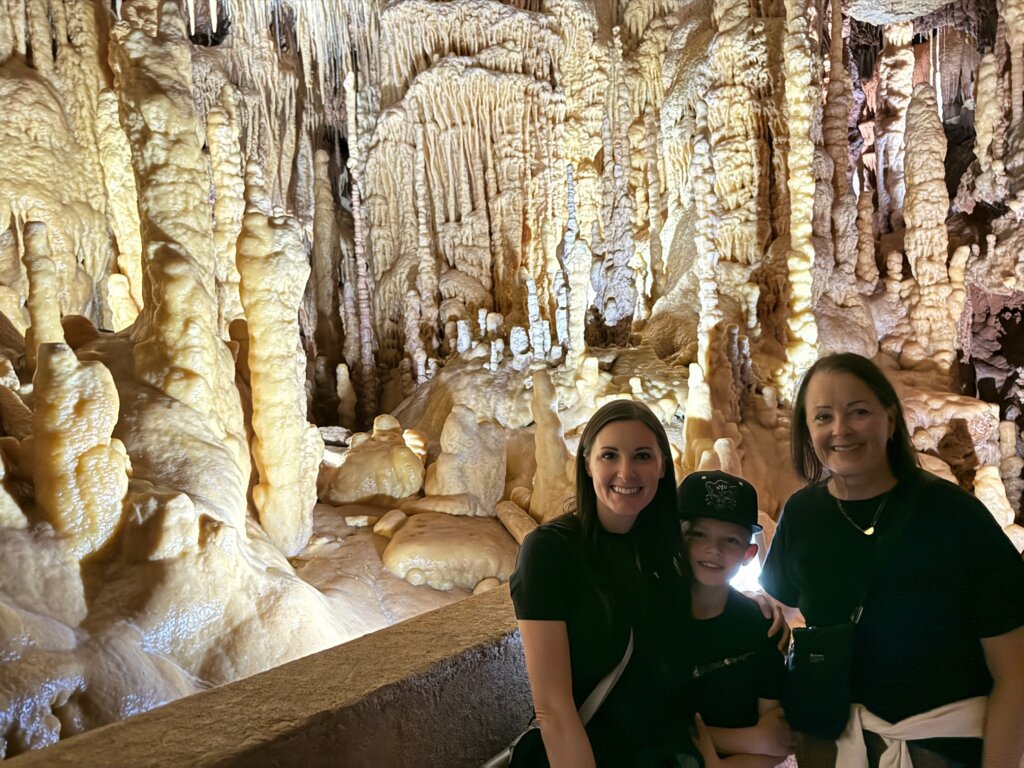 Two women with boy in caverns.