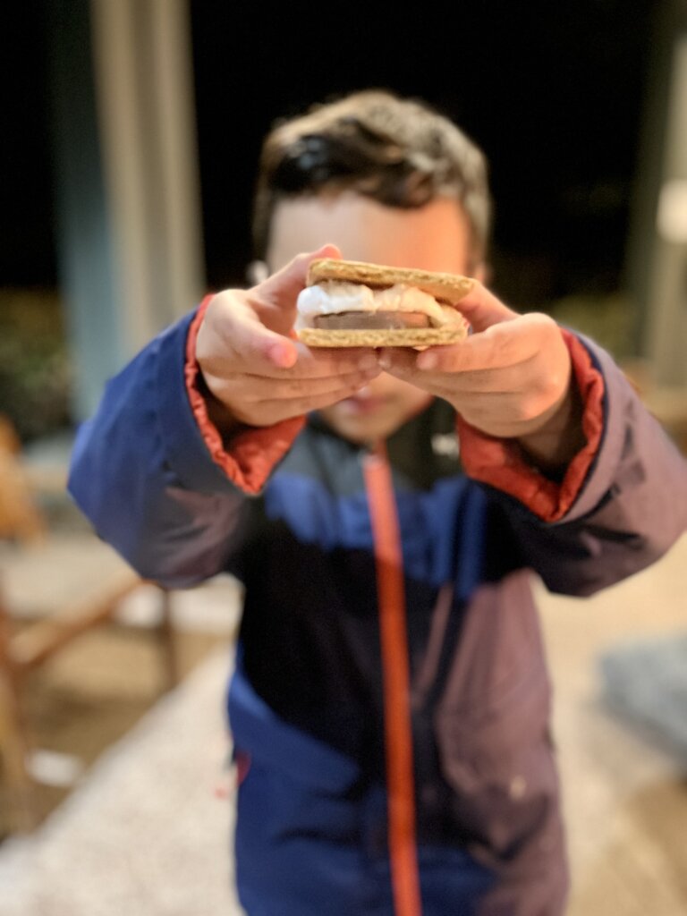 Child holding s'mores.