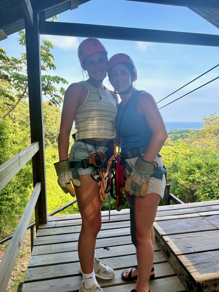 Two girls ready to zipline