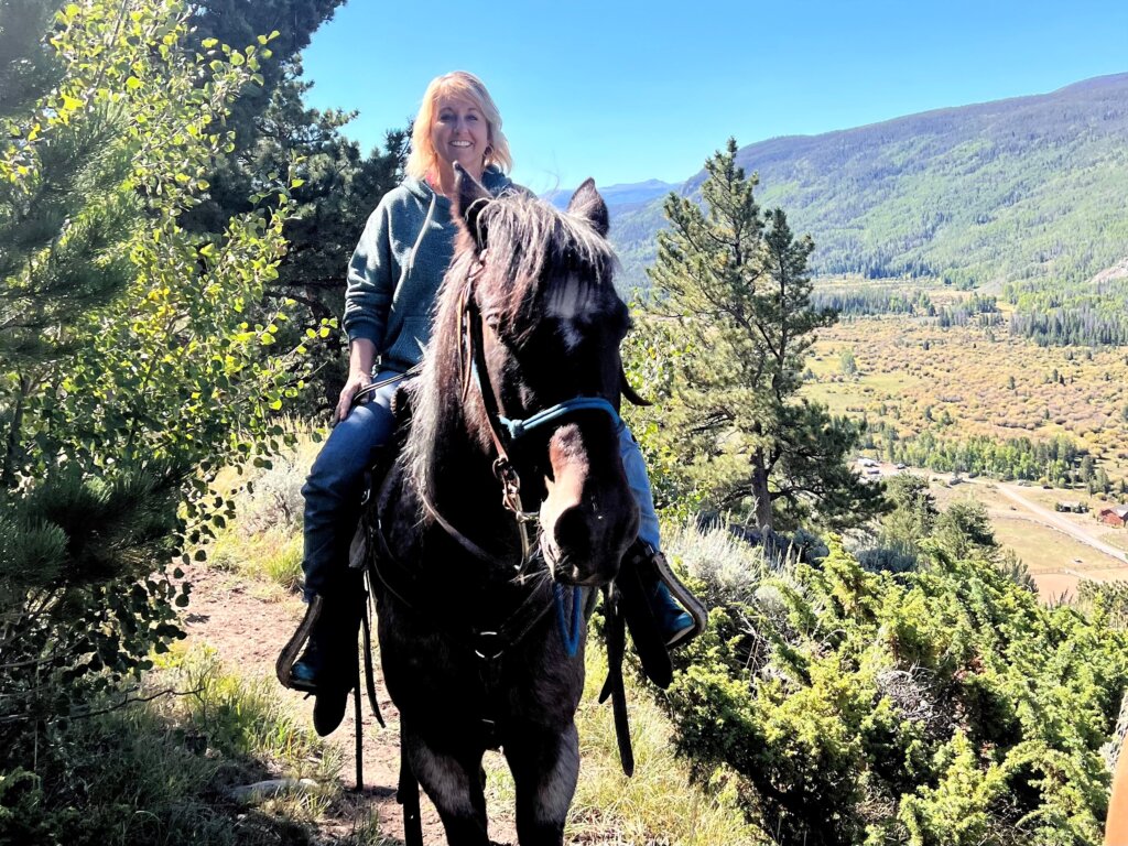 Woman riding horse