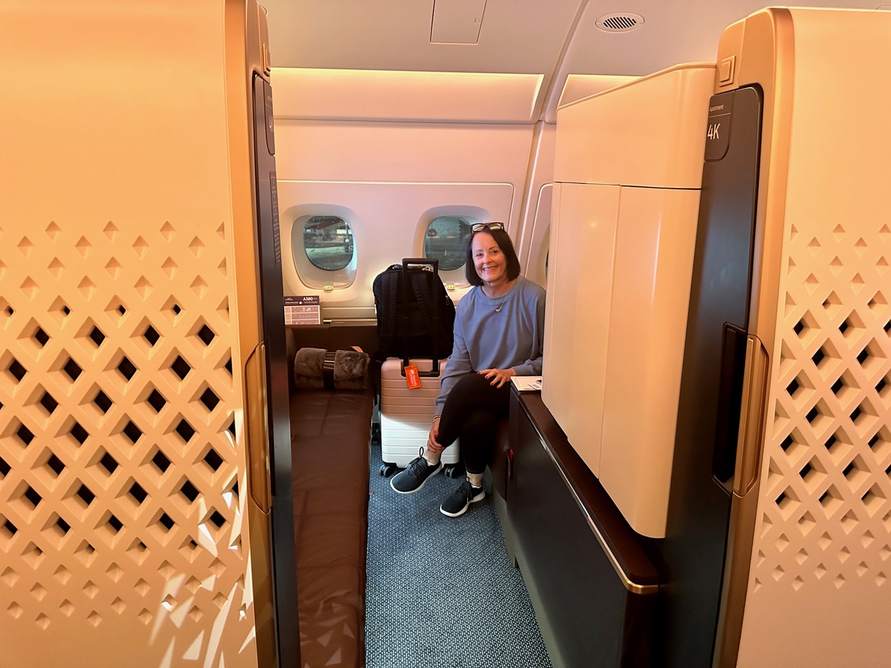 Woman sitting in airplane suite