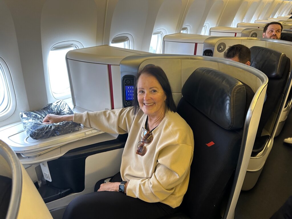 Woman sitting in business class seat