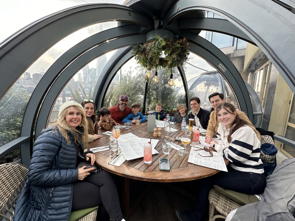 People eating dinner under a dome