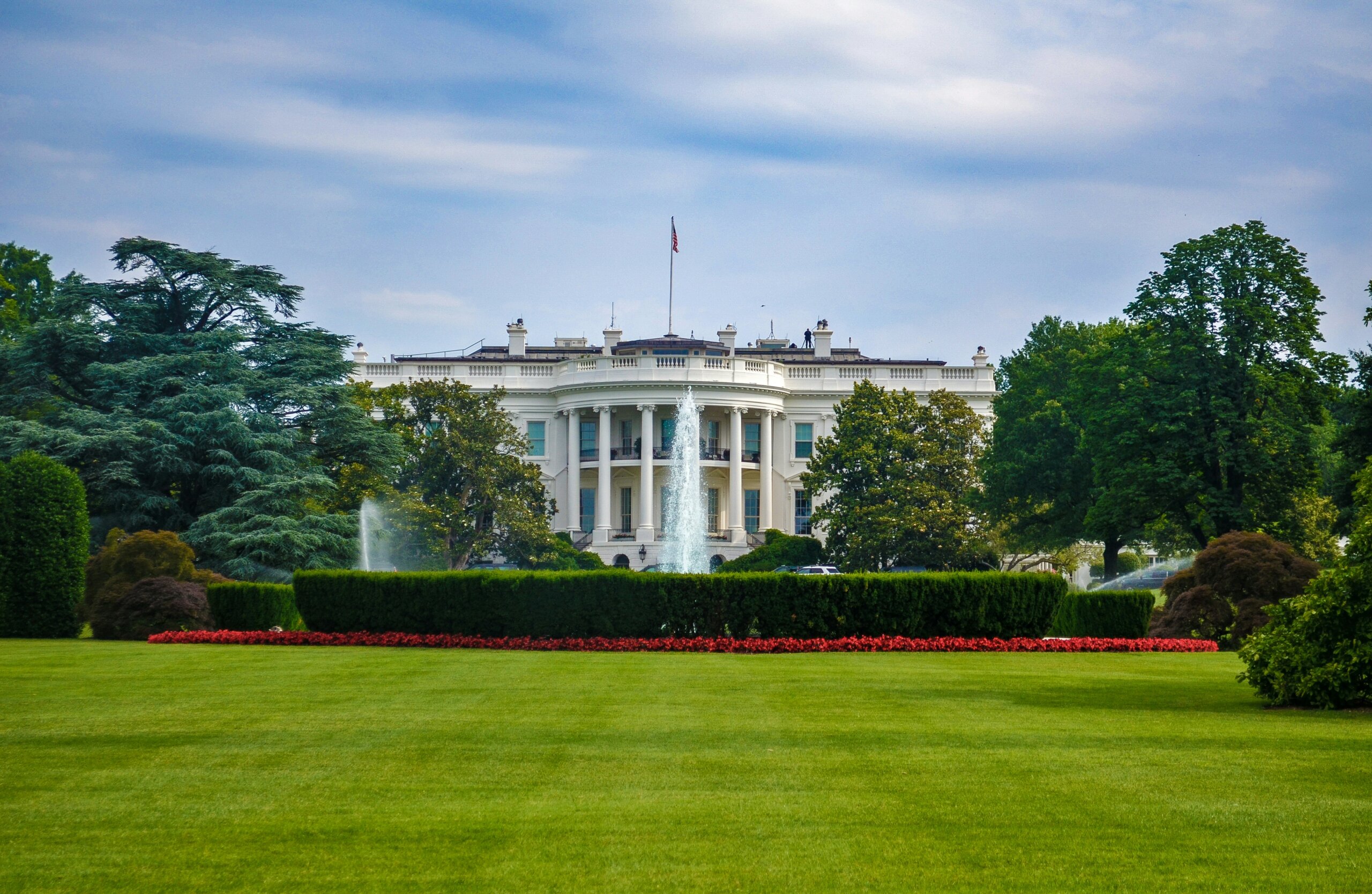 Large white building with green lawn