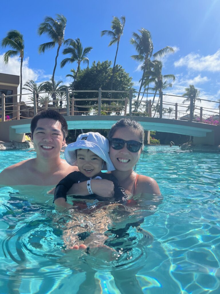 Man, woman, and child in pool