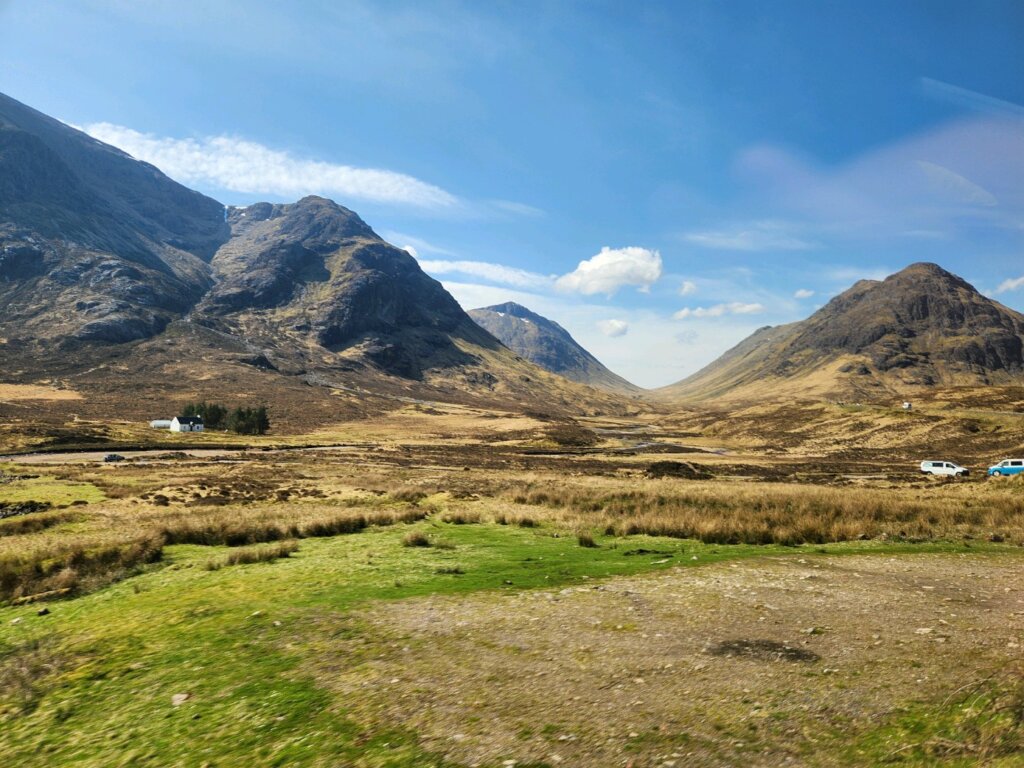 Field and a valley near a hill