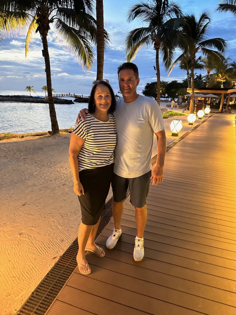 Man and women near beach at dusk