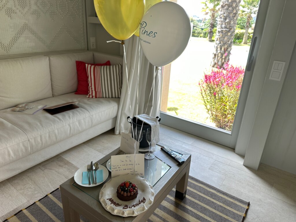 Birthday cake and balloons on a table