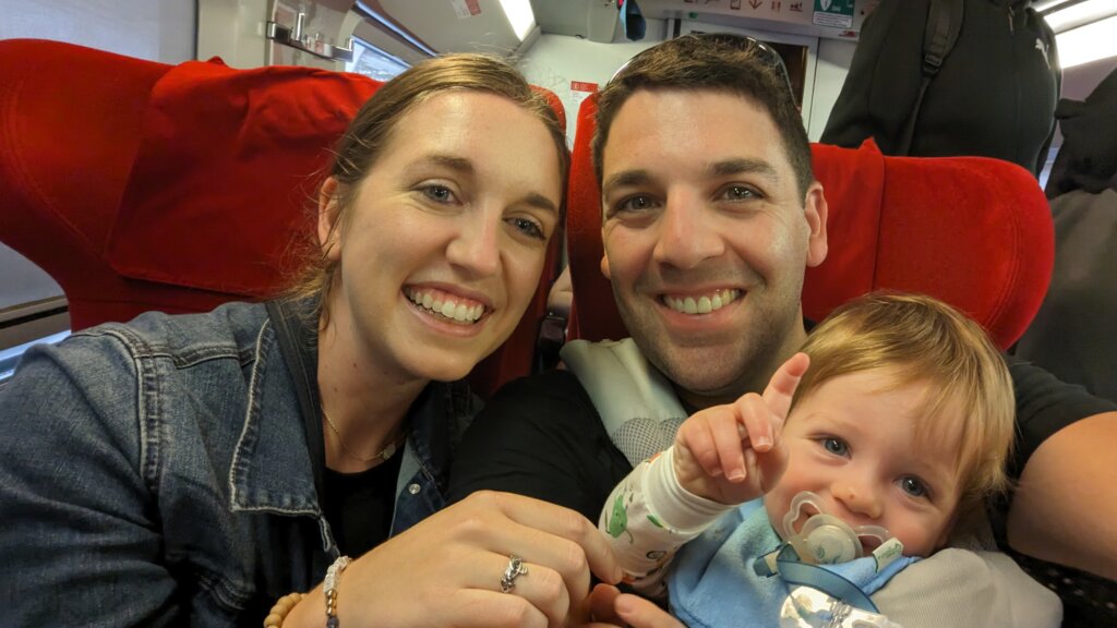 Small boy on plane with woman and man