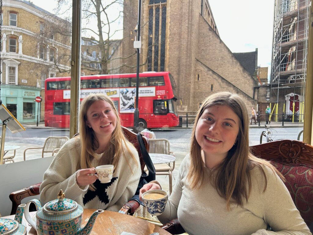 Two girls enjoying tea