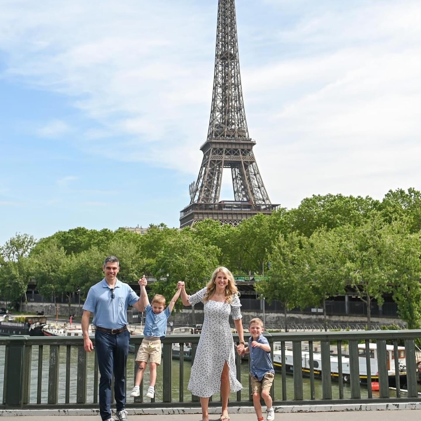 Family standing in front of large tower