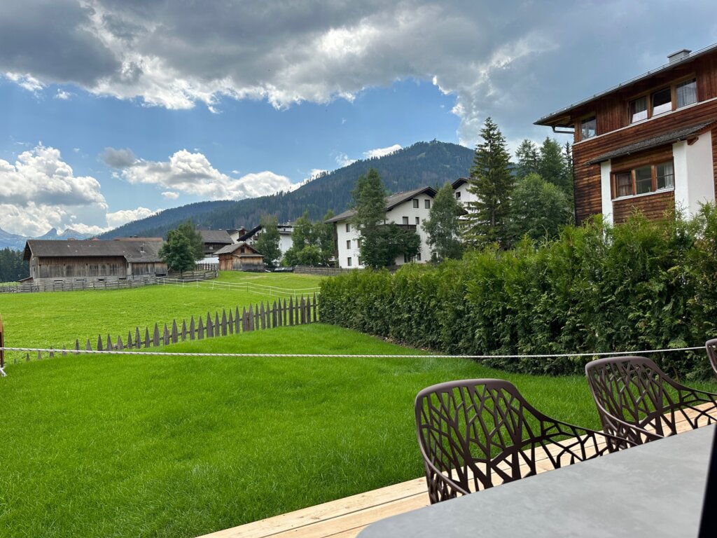 Outdoor patio with views of green hills