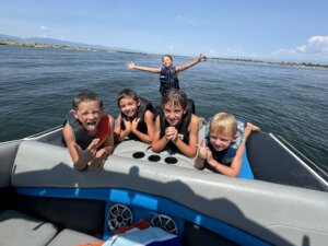 kids on a boat in colorado